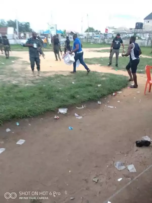 See The Moment Thugs Snatched Ballot Boxes In Rivers State While The Police Protect Them (Photos)